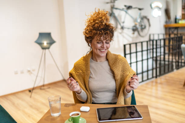 istock Cheerful woman listening music 1751931084