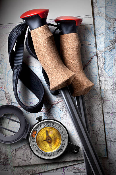 istock Compass and trekking poles on topographic maps 175194140