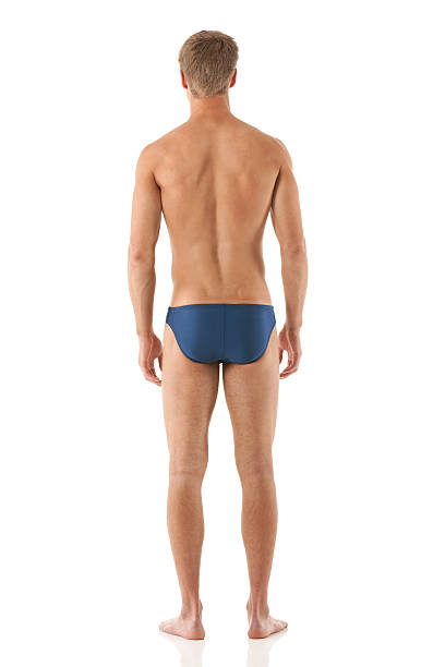 vista traseira de um homem natação pé - swimming male isolated swimming goggles imagens e fotografias de stock