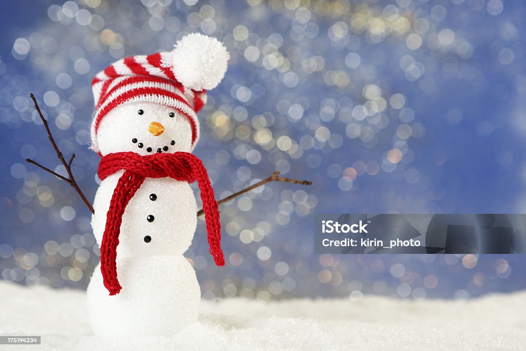 A cute little snowman wearing a hat and scarf snowman Backgrounds Stock Photo
