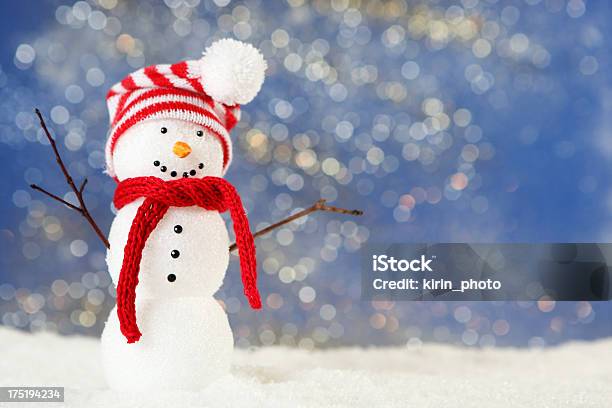 A Cute Little Snowman Wearing A Hat And Scarf Stock Photo - Download Image Now - Backgrounds, Snowman, Blue