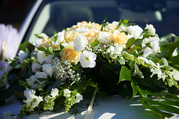 istock The composition from fresh flowers on the holiday car. 1751943056
