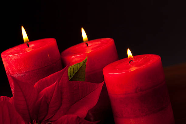 istock Candles with Poinsettia in the Foreground 175194385