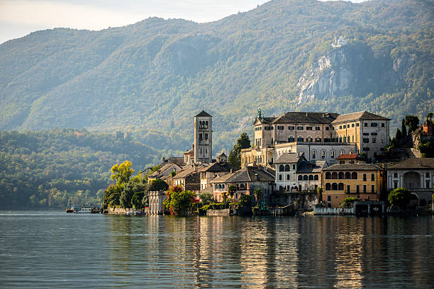 Orta San Giulio island Orta San Giulio island in the lake Orta, North Italy, Piedmont.. italian lake district photos stock pictures, royalty-free photos & images