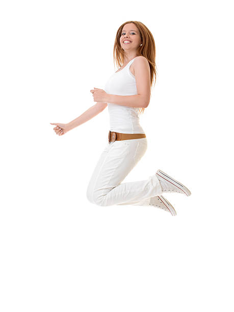 молодая девушка прыжки - arms outstretched teenage girls jumping flying стоковые фото и изображения