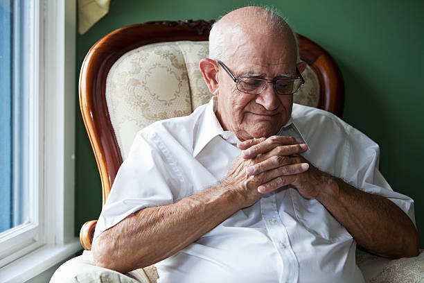 istock Senior man with eyes closed and hands clasped 175195017