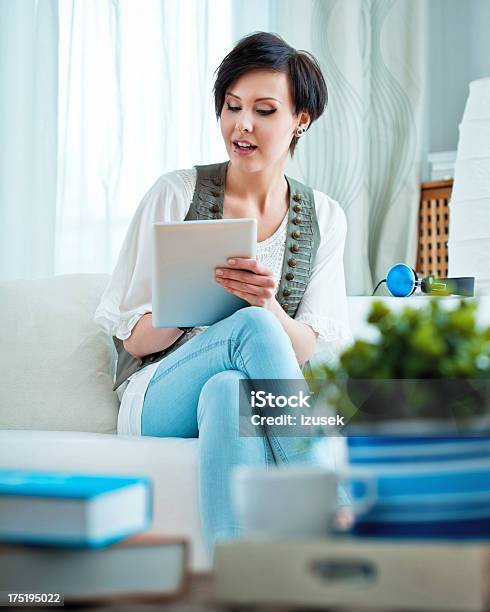 Young Woman Using Digital Tablet Stock Photo - Download Image Now - 20-24 Years, Adult, Adults Only