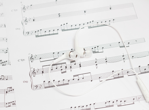 earbuds and sheet music