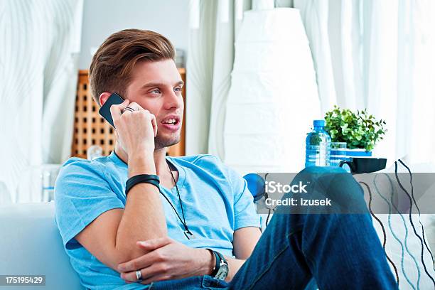 Young Man On Phone Stock Photo - Download Image Now - 20-24 Years, Adult, Adults Only