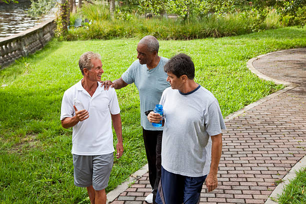 istock Men walking in park after exercising 175195734
