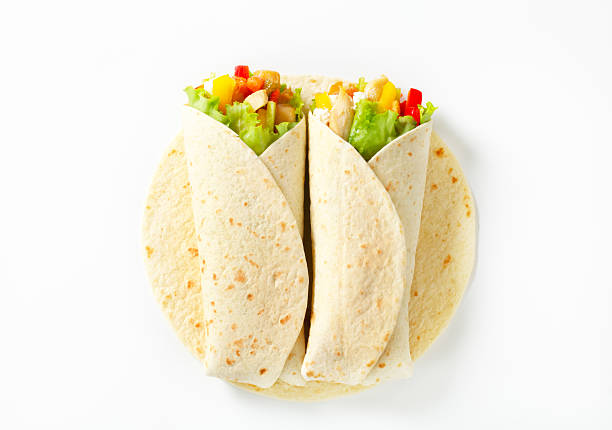 Isolated image of two Mexican fajitas, tortilla wraps stock photo