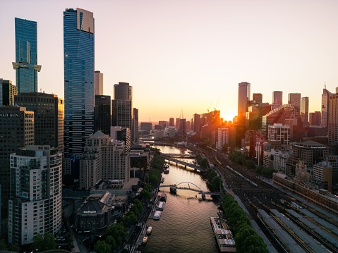 An aerial shot of the cityscape of Melbourne at sunset.