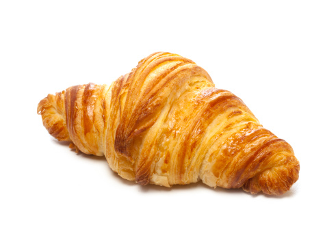 Delicious croissant on white background