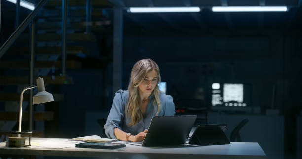 istock Thinking, night and office with business woman and problem solving with planning and work project. Laptop, report idea and entrepreneur of an female professional with deadline and app review 1751963071