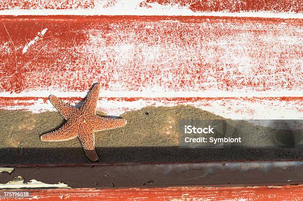 Starfish On The Back Of A Red Boat Stock Photo - Download Image Now - Backgrounds, Beach, Beige