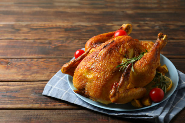 istock Thanksgiving Day roast turkey on wooden background 1751966353
