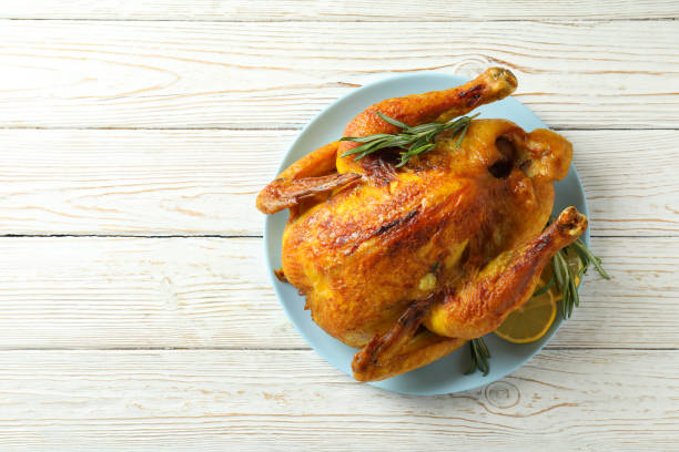 istock Plate with roast turkey on white wooden table 1751973690