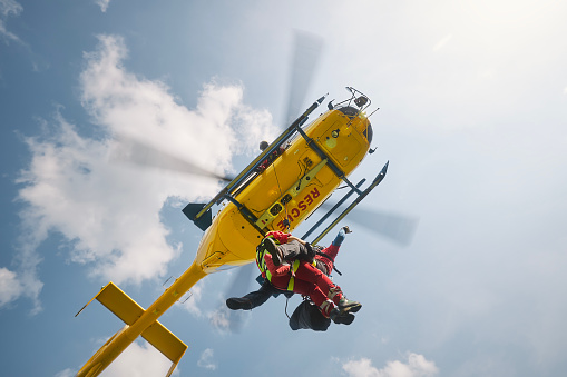 A TCAA helicopter is waiting for a patient in Regent's Park. The Children's Air Ambulance Service is a charity-funded air ambulance that transfers critically ill children from local hospitals to specialist pediatric centers across the UK.