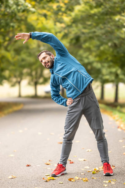 istock A young athlete is warming up before running training in the park. 1751978600