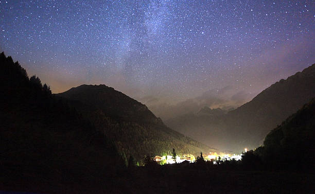 istock milkyway over a small village 175198438