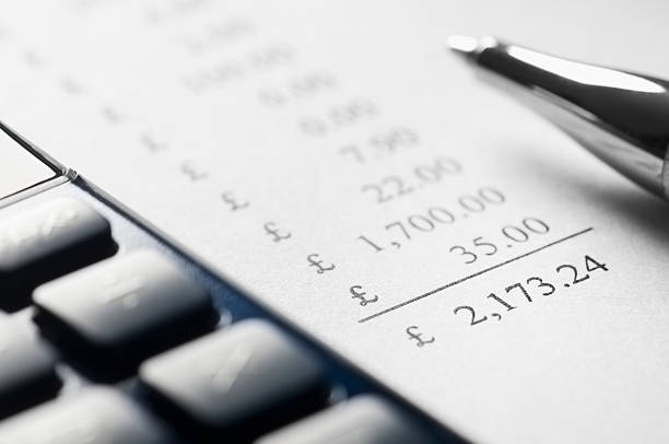istock Financial calculations with a calculator and pen 175198832