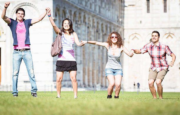 istock Multiracial Friends jumping on the grass 175199587