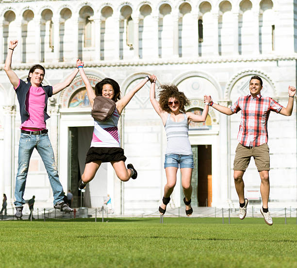istock Multiracial Friends jumping on the grass 175199591