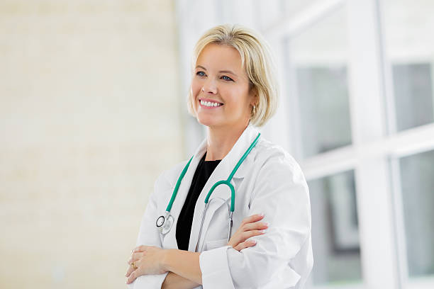 istock Female doctor smiling with arms crossed 175199816