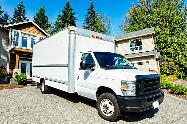 istock Plain White Moving Truck in Driveway 175199936