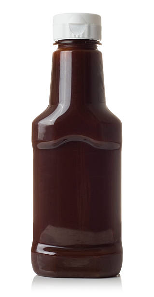 Close-up of brown sauce isolated on white Brown sauce bottle isolated on a white background. barbeque sauce photos stock pictures, royalty-free photos & images