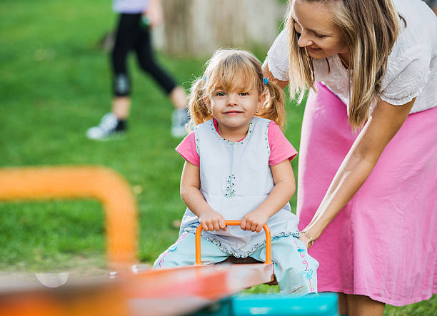 istock Mother with her daughter enjoying in playground. 175200700
