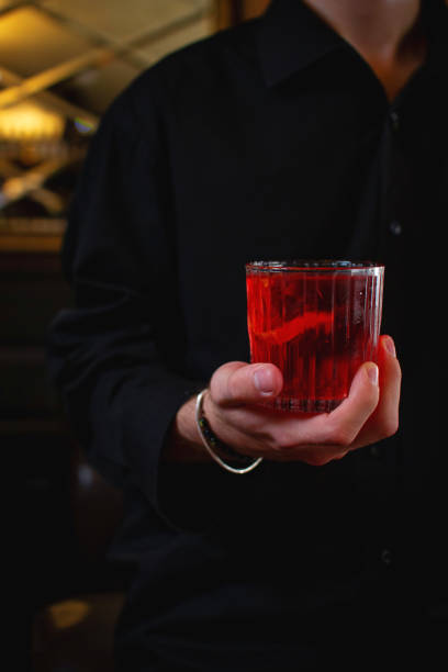 istock Crimson Alcoholic Beverage in Hand: Refreshing Glass 1752008554