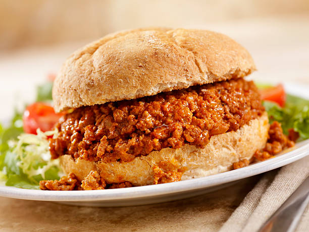 Sloppy Joe Sloppy Joe with a Side Salad-Photographed on Hasselblad H3D2-39mb Camera sloppy joes stock pictures, royalty-free photos & images