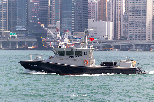 Hong Kong - October 23, 2023 : Hong Kong Police Force Patrol Boat at Victoria Harbour, Hong Kong.