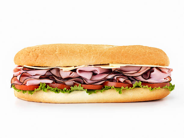 Foot Long Ham and Swiss Cheese Sub 12 inch -Black Forest Ham and Cheddar Cheese Submarine Sandwich with Lettuce and Tomato on a Crusty Bun-Photographed on Hasselblad H3D2-39mb Camera ham and cheese sandwich stock pictures, royalty-free photos & images