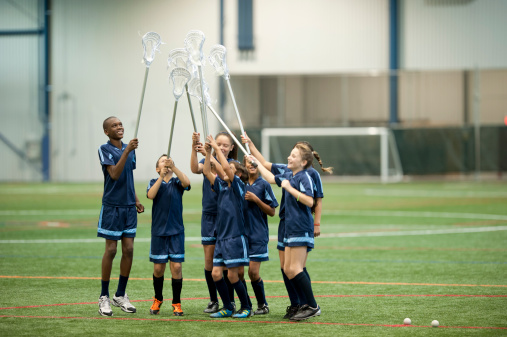 Rugby, team and winning with trophy, champion and men at stadium with success, celebration and achievement. Male people outdoor, exercise and competition, sports game and cheers with mockup space