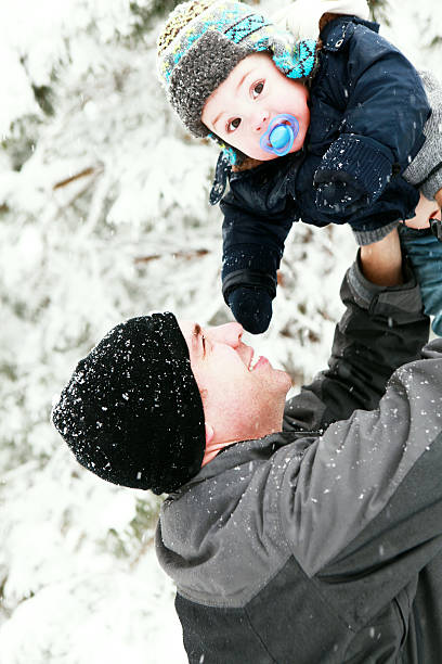 Father and Child in Snow stock photo