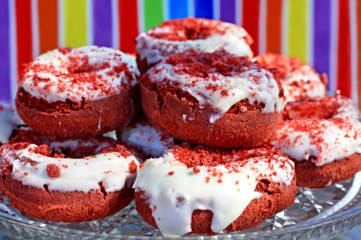 Plate of red velvet donuts.