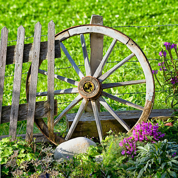istock Old wheel garden decoration 175202945