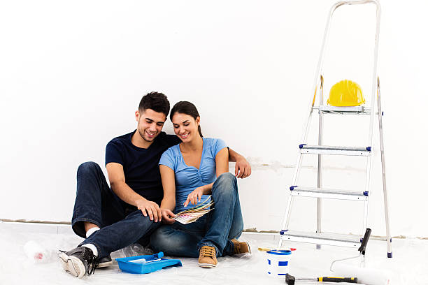 istock Couple ralaxing while painting new home 175203599