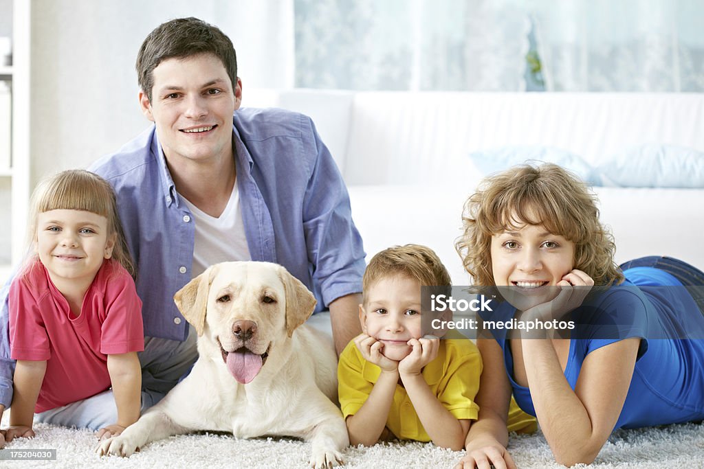 Family with pets A family portrait with their dog spending time at home 30-34 Years Stock Photo