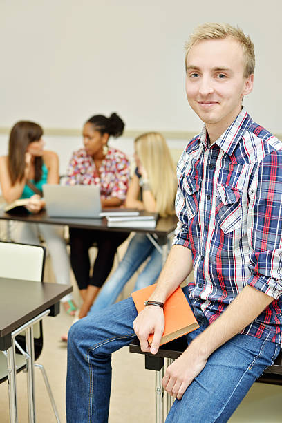 istock Young male student sitting in the classroom 175204396
