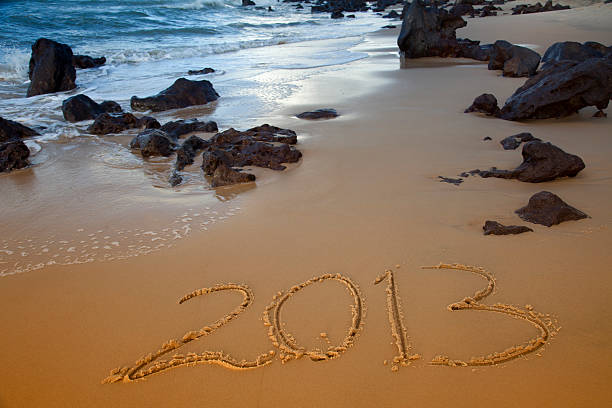 feliz ano novo - 2013 beach sand new years day imagens e fotografias de stock