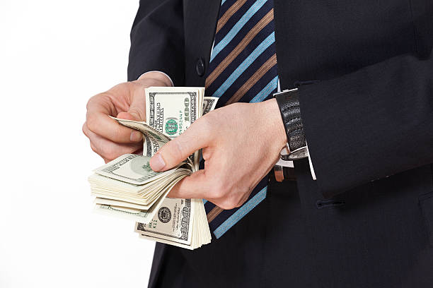 istock businessman counting money 175205565