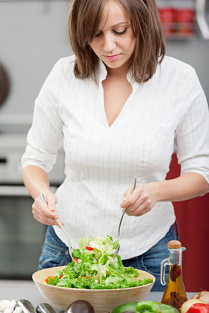 istock Young woman making salad 175206035