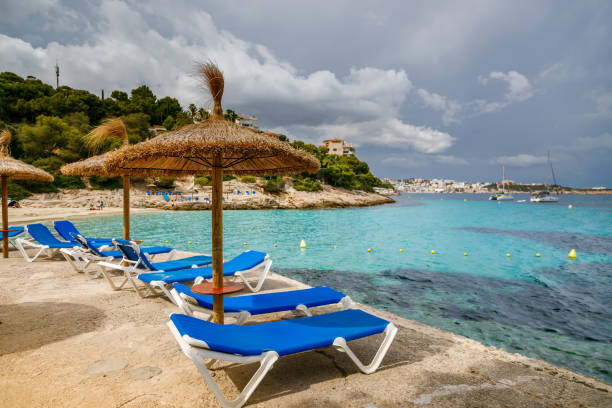 istock Beach umbrellas and chaise lounges at Playa de Illetes beach 1752060952