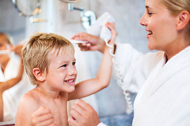 istock Little boy drying up hair after bath 175206318