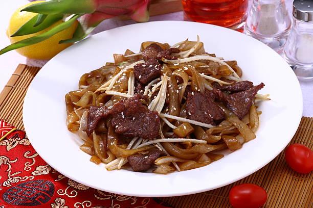 Fried beef flat rice noodle (dry fried cattle river) stock photo