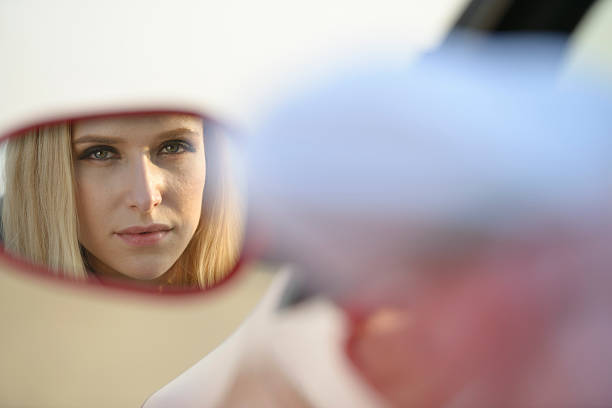 istock Reflection of pretty woman from car side mirror 175206554