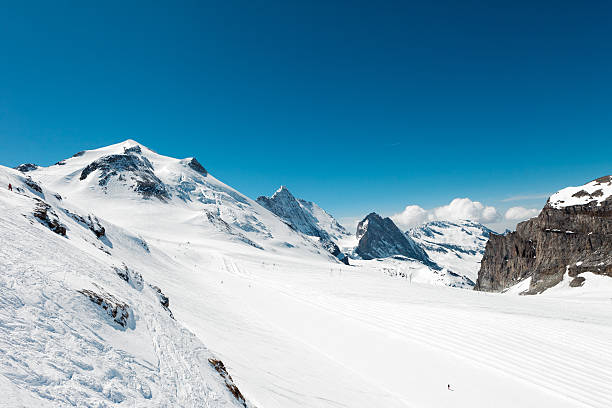 istock Powder snow at mountain peaks 175207070